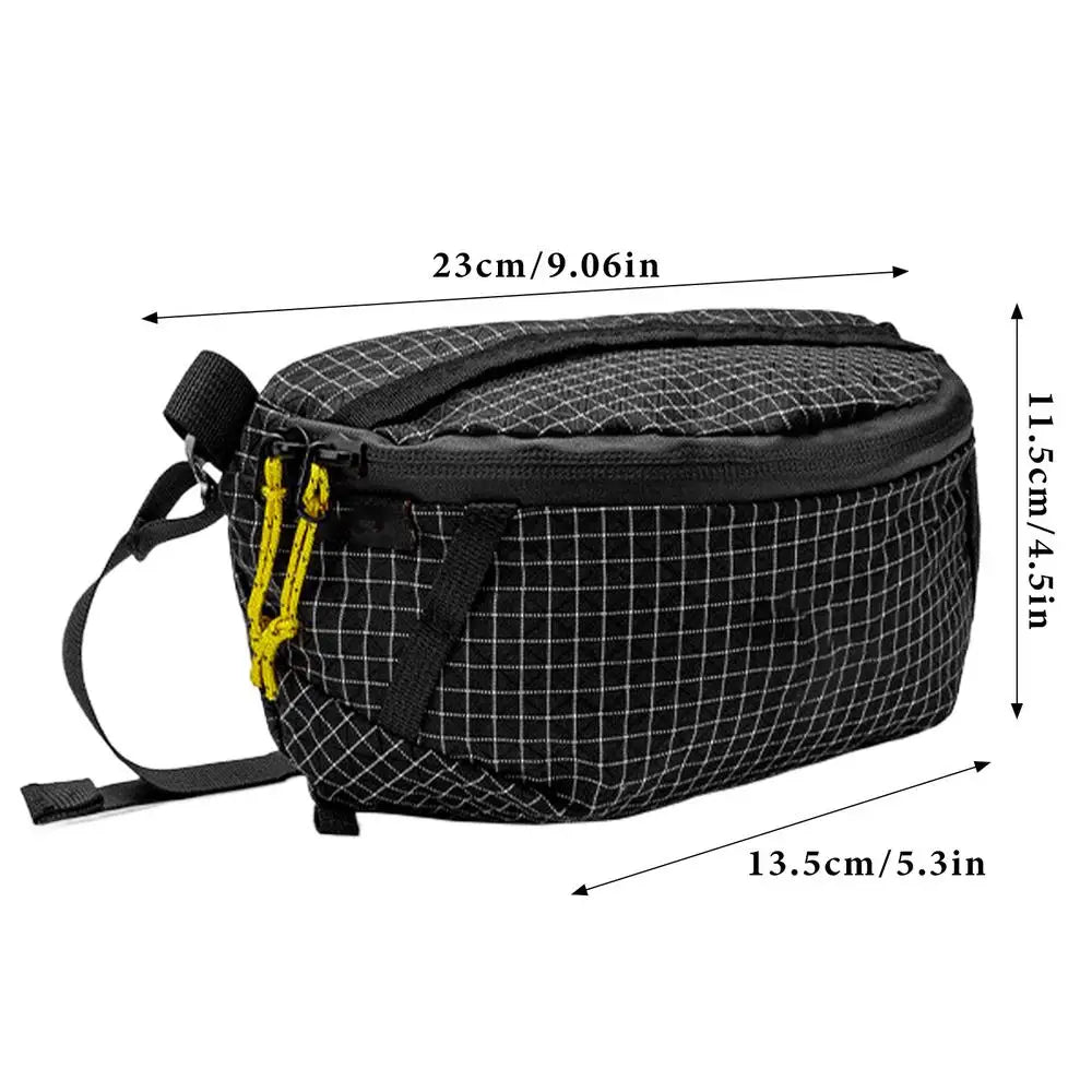 Black grid-patterned bag with measurements on a white background