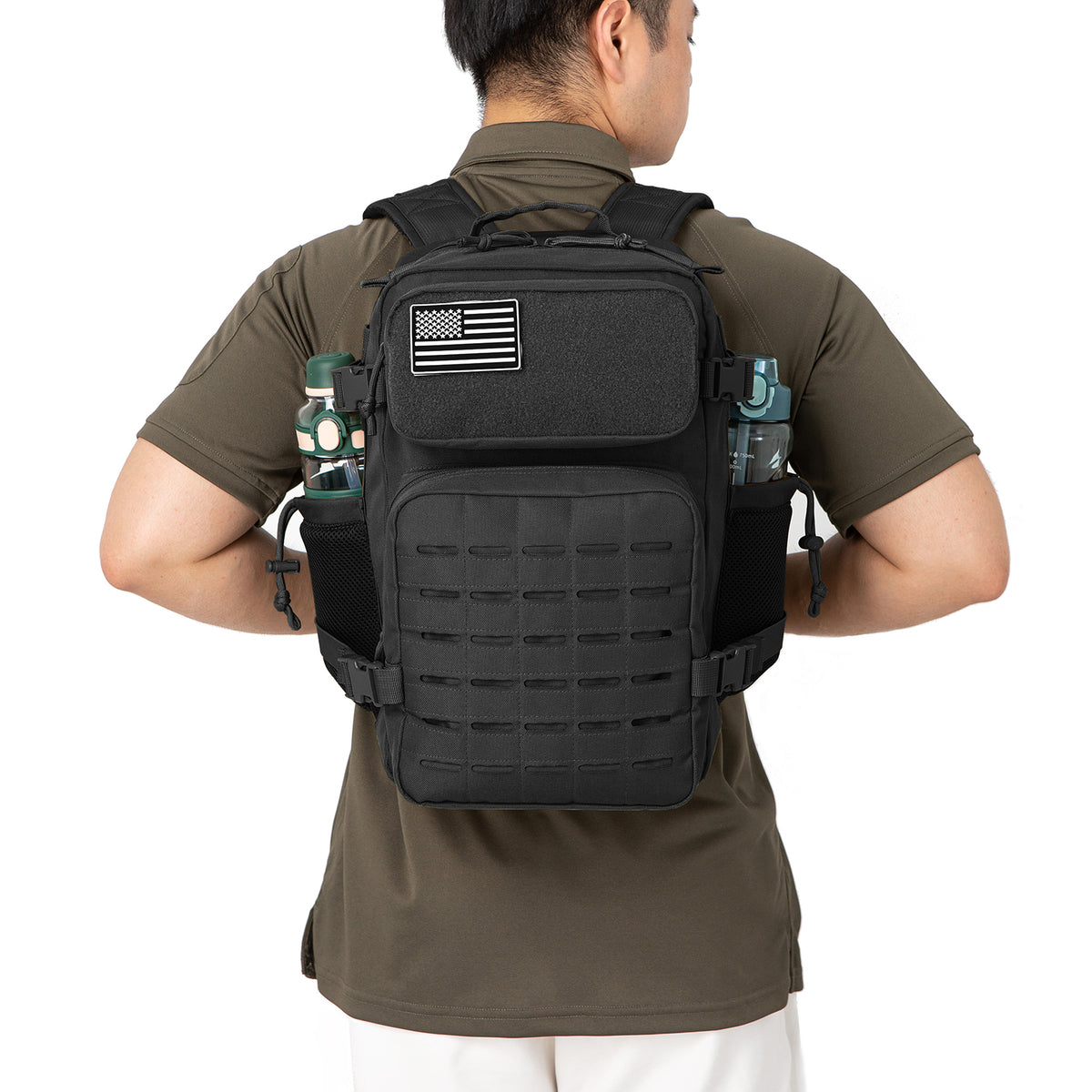 25L black tactical backpack worn on the back for outdoor use