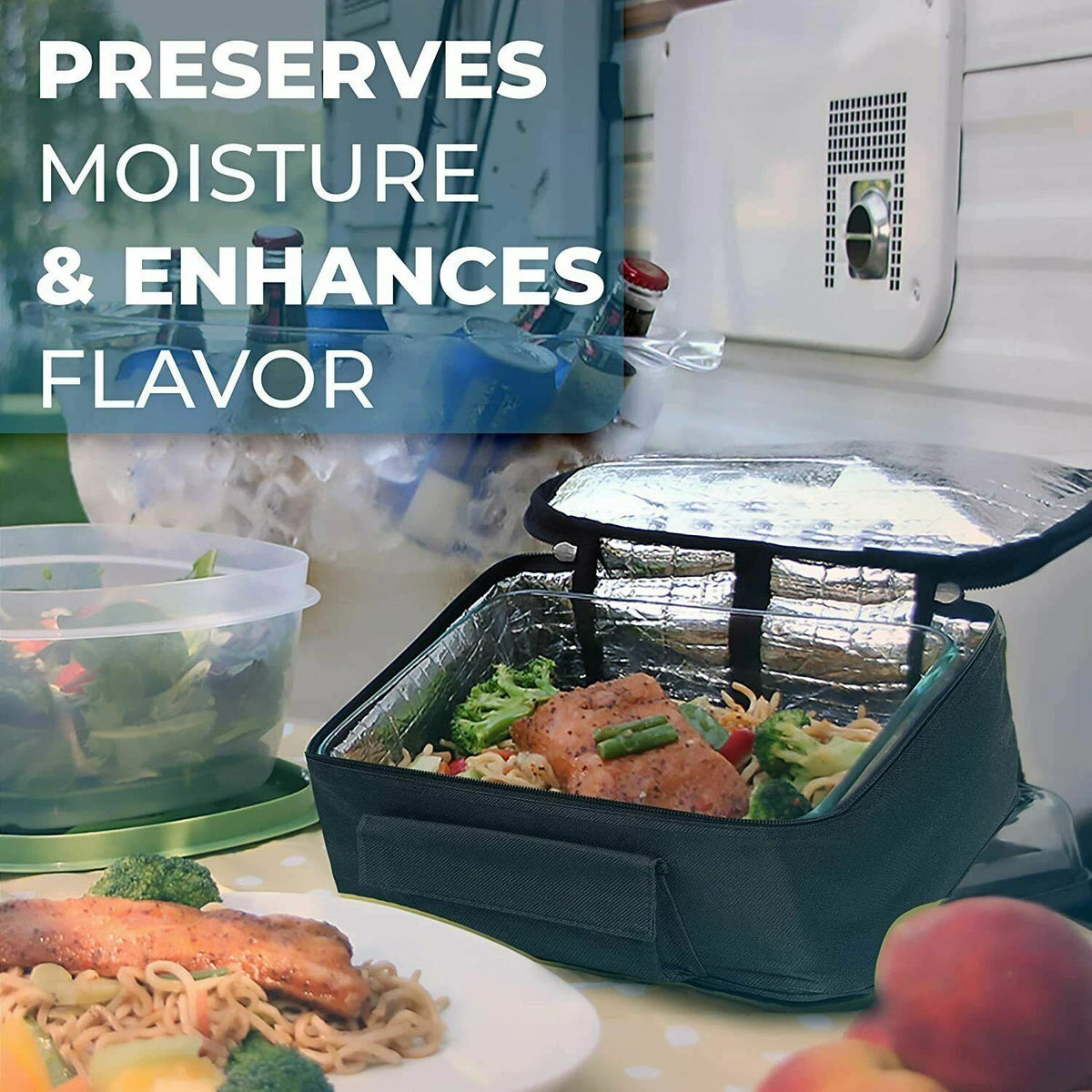 A black insulated lunch bag with a silver foil-lined interior sits open on a table, containing a meal with broccoli and chicken. A clear plastic container of salad is blurred in the background, with a plate of food in the foreground.