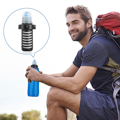 Man with a backpack holding a blue water bottle with a filter, outdoors.