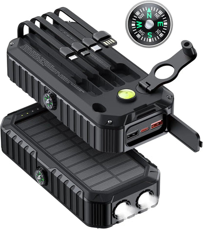 Black portable power station with solar panel, LED lights, and compass on a white background
