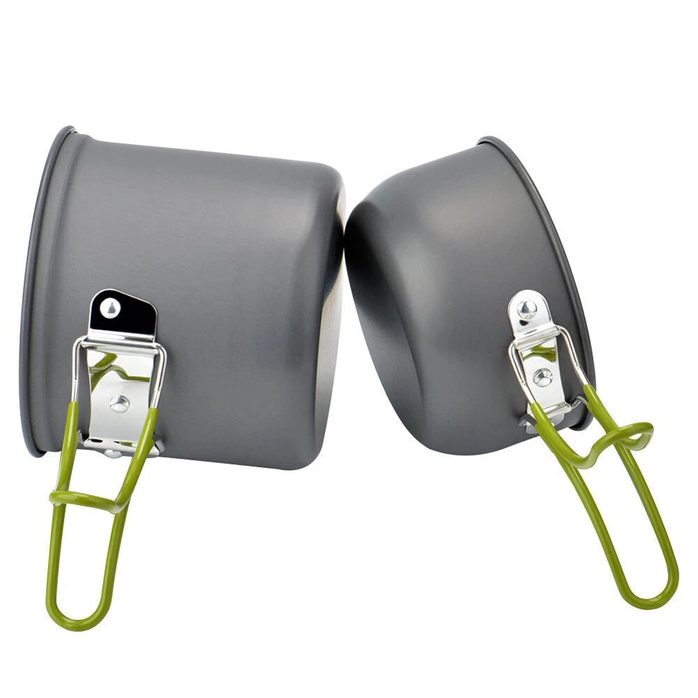 Two gray metal pots with green handles on a white background