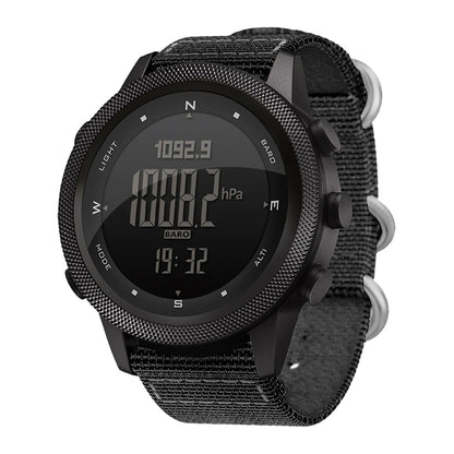 A rugged black digital sports watch with a textured bezel, black fabric strap, and silver metal side buttons, shown on a plain white background.