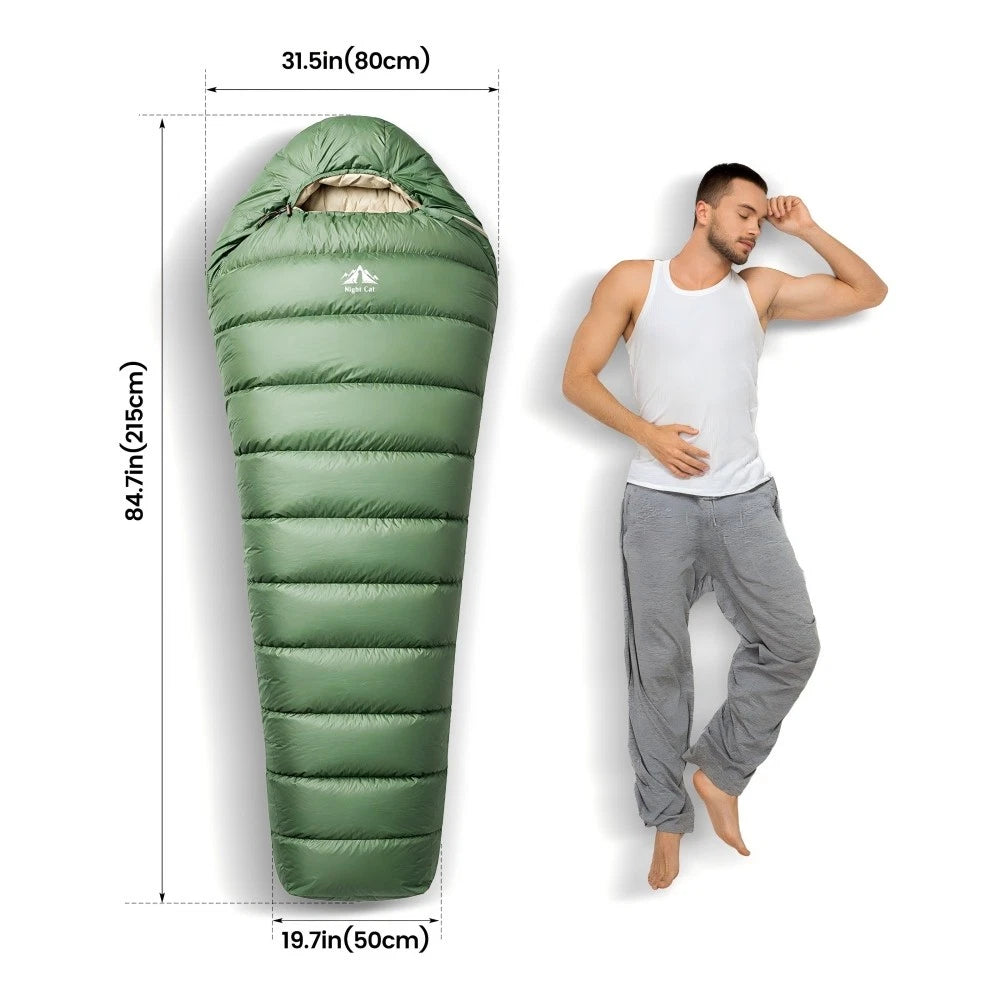 An olive green mummy-style sleeping bag shown with dimension lines and measurements, alongside a man wearing loose white and gray lounge pants on a white background.