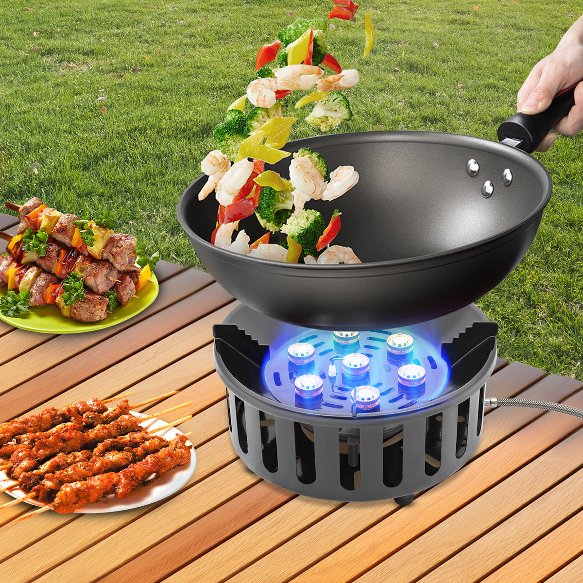 Portable camping stove used for outdoor cooking with a frying pan