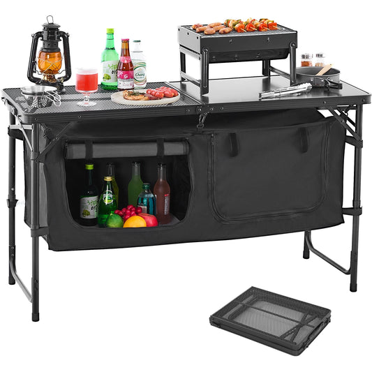 Black camping kitchen table with storage compartments, food, and drinks on a white background
