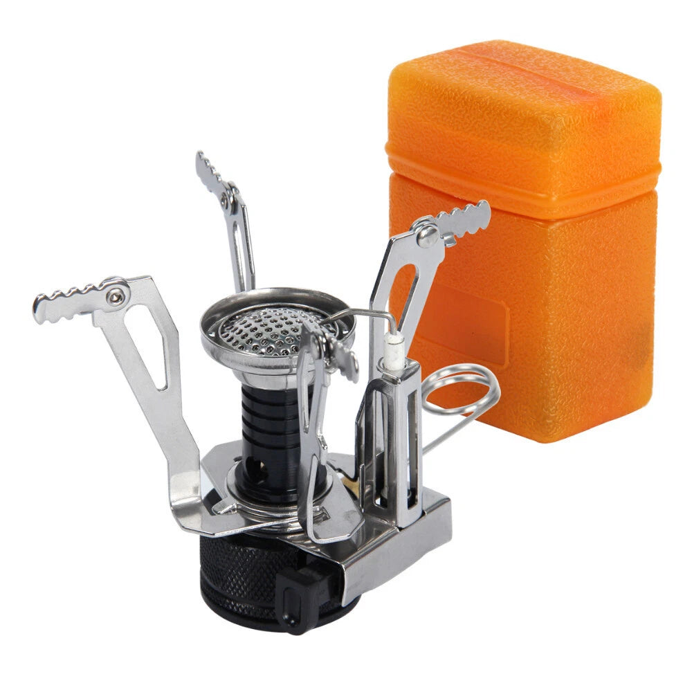 A compact stainless steel portable camping stove with a black fuel column and side legs, shown next to its bright orange foam storage case on a white background.
