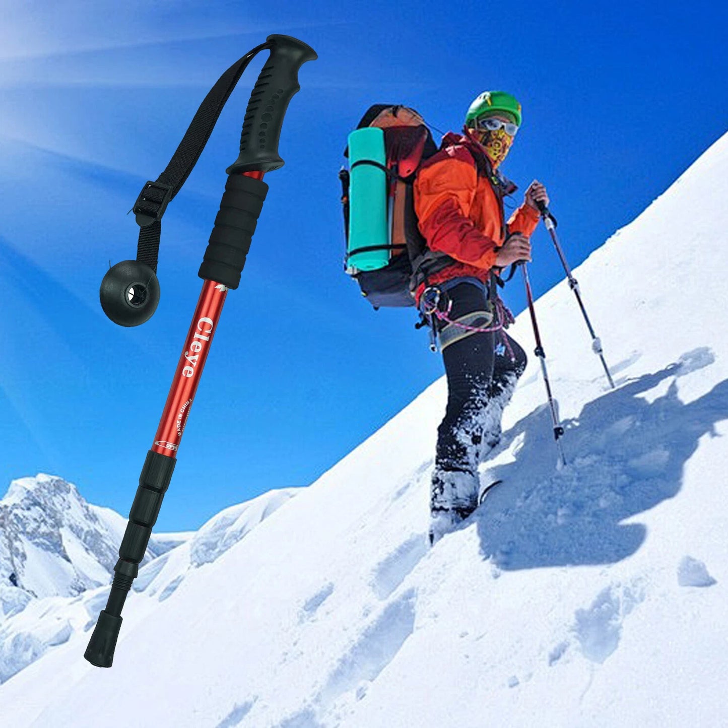 Person hiking up a snowy mountain with trekking poles and backpack, featuring a close-up of a trekking pole.
