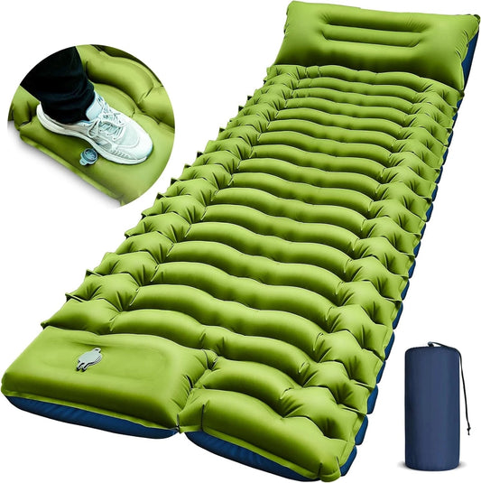 Green inflatable camping mattress with a foot pump and carrying bag on a white background