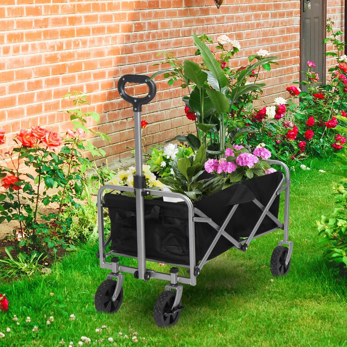 Foldable garden cart with plants in a garden setting