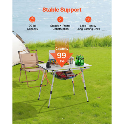 Camping table with chair on grassy area, featuring stable support features.