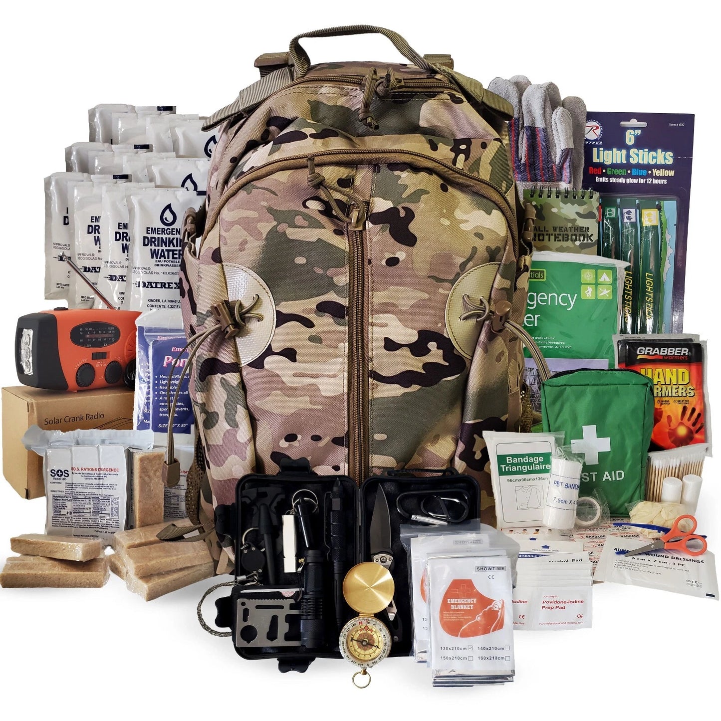 A large camouflage backpack shown with an extensive survival and emergency gear kit arranged in front of it on a plain white background. The kit includes water filters, emergency rations, a red-and-black radio, light sticks, first aid supplies, bandages, and other outdoor survival items.