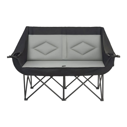 A black and gray folding camp lounger with a padded seat and backrest, shown on a plain white background.